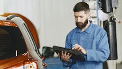 Technician with scan tool Technician with scan tool