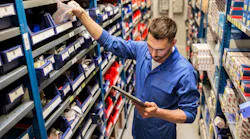 Counterman or warehouse worker pulling parts from shelf