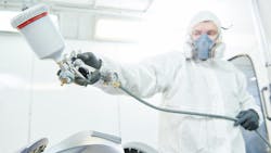 Spraying in booth Spraying in booth