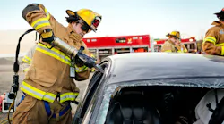 Firefighter using extrication tool