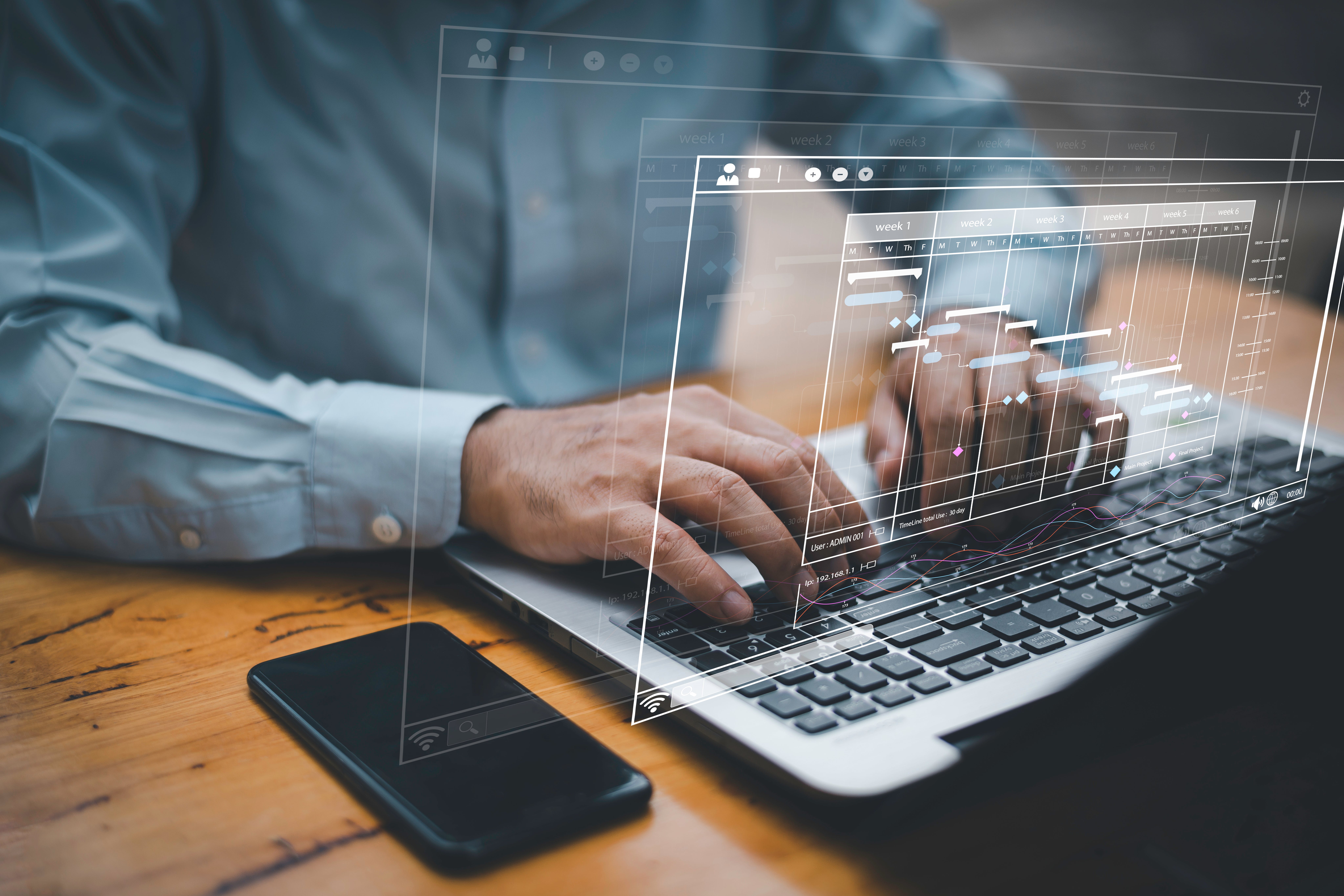 Man crunching numbers at laptop