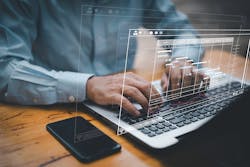 Man crunching numbers at laptop Man crunching numbers at laptop