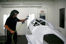 Jason Shup gets ready to spray a bumper cover at Steve's Auto Body. Jason Shup gets ready to spray a bumper cover at Steve's Auto Body.
