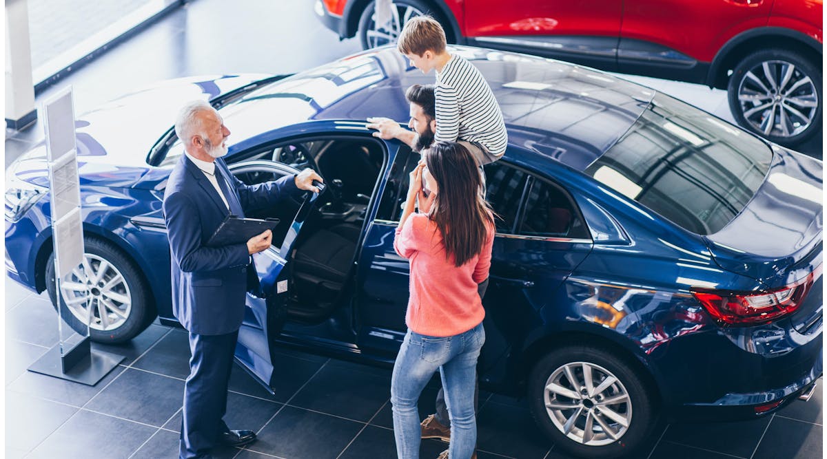 Family at new-car dealership