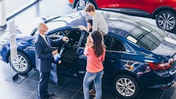 Family at new-car dealership Family at new-car dealership