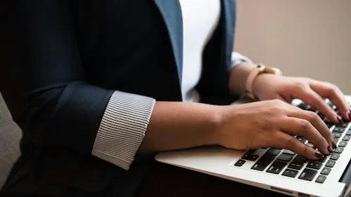 Person typing on laptop