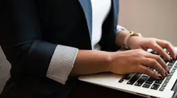 Person typing on laptop