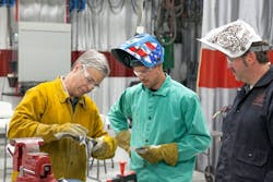 Figure 4 – I-CAR instructors work closely with technicians to they have the knowledge and skills to successful complete MIG braze joints. Figure 4 – I-CAR instructors work closely with technicians to they have the knowledge and skills to successful complete MIG braze joints.