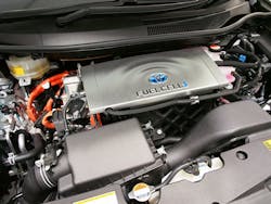 A look underhood of a fuel cell vehicle (FCEV). Notice the orange cables denoting the high-voltage system like an electric vehicle. A look underhood of a fuel cell vehicle (FCEV). Notice the orange cables denoting the high-voltage system like an electric vehicle.