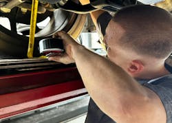 Brian Hamel checks ride height before alignment. Brian Hamel checks ride height before alignment.