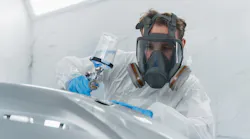 Painter in paint booth