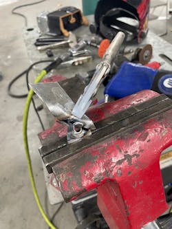 Technician Jason Hodge performs the destructive test on a plug weld. He will then measure the nugget diameter. Technician Jason Hodge performs the destructive test on a plug weld. He will then measure the nugget diameter.