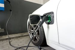 EV connected to battery charging station EV connected to battery charging station