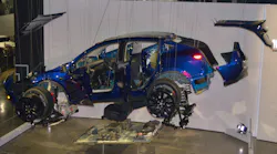 This exploded diagram 2023 Tesla Model Y is part of the 'Inside Tesla' exhibit at The Petersen Automotive Museum.