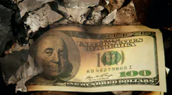 US $100 bill in fire