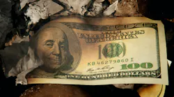 A $100 Bill Halfway From Being Burned