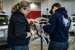 Danica Wooster working with MCST student Bryson Mattox plastic welding a wheel flare. Danica Wooster working with MCST student Bryson Mattox plastic welding a wheel flare.
