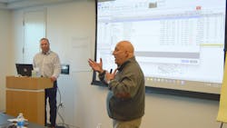 Kris Burton (left), owner of Rosslyn Auto Body, Alexandria, Virginia, and Mike Anderson, Collision Advice, go over a sample estimate. Kris Burton (left), owner of Rosslyn Auto Body, Alexandria, Virginia, and Mike Anderson, Collision Advice, go over a sample estimate.