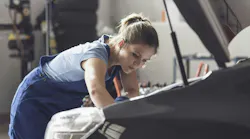 woman_working_on_a_car_engine
