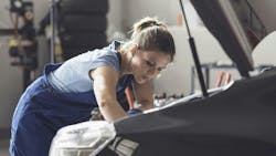 woman_working_on_a_car_engine