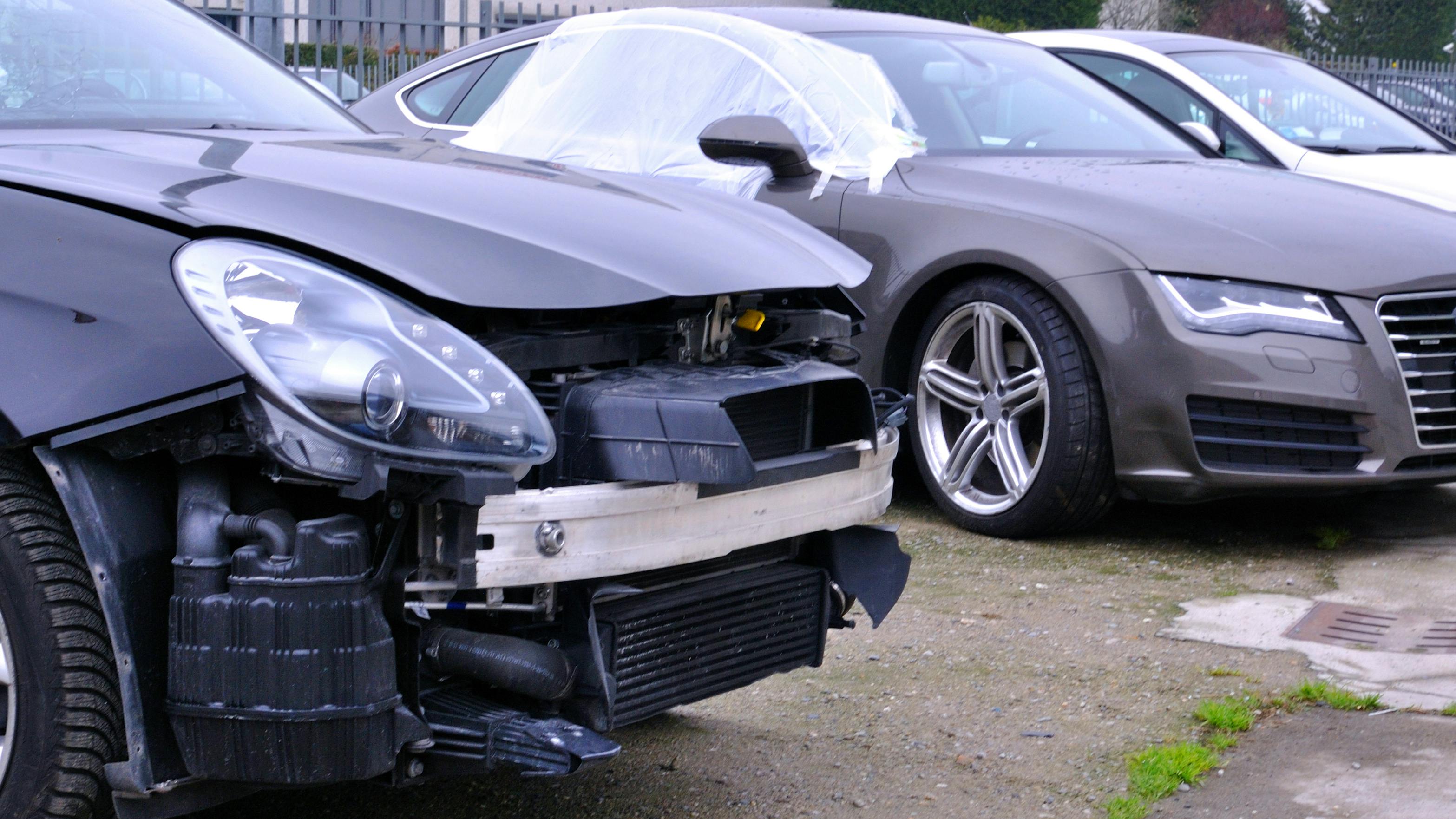 65f86374eb9b1a001ee1235e Collisiondamaged Euro Cars In Back Lot Dreamstime