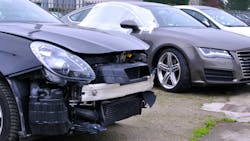 collisiondamaged_euro_cars_in_back_lot