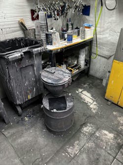 This paint mix room shows a couple violations: the plastic trash can needs to be a metal one with a closed metal lid, and the liquid solvent paint-waste container needs to be grounded and include a waste-paint label. This paint mix room shows a couple violations: the plastic trash can needs to be a metal one with a closed metal lid, and the liquid solvent paint-waste container needs to be grounded and include a waste-paint label.