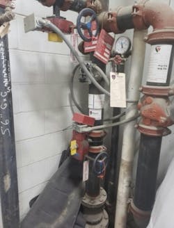 The tag on this fire suppression system shows it has been serviced on schedule. The tag on this fire suppression system shows it has been serviced on schedule.