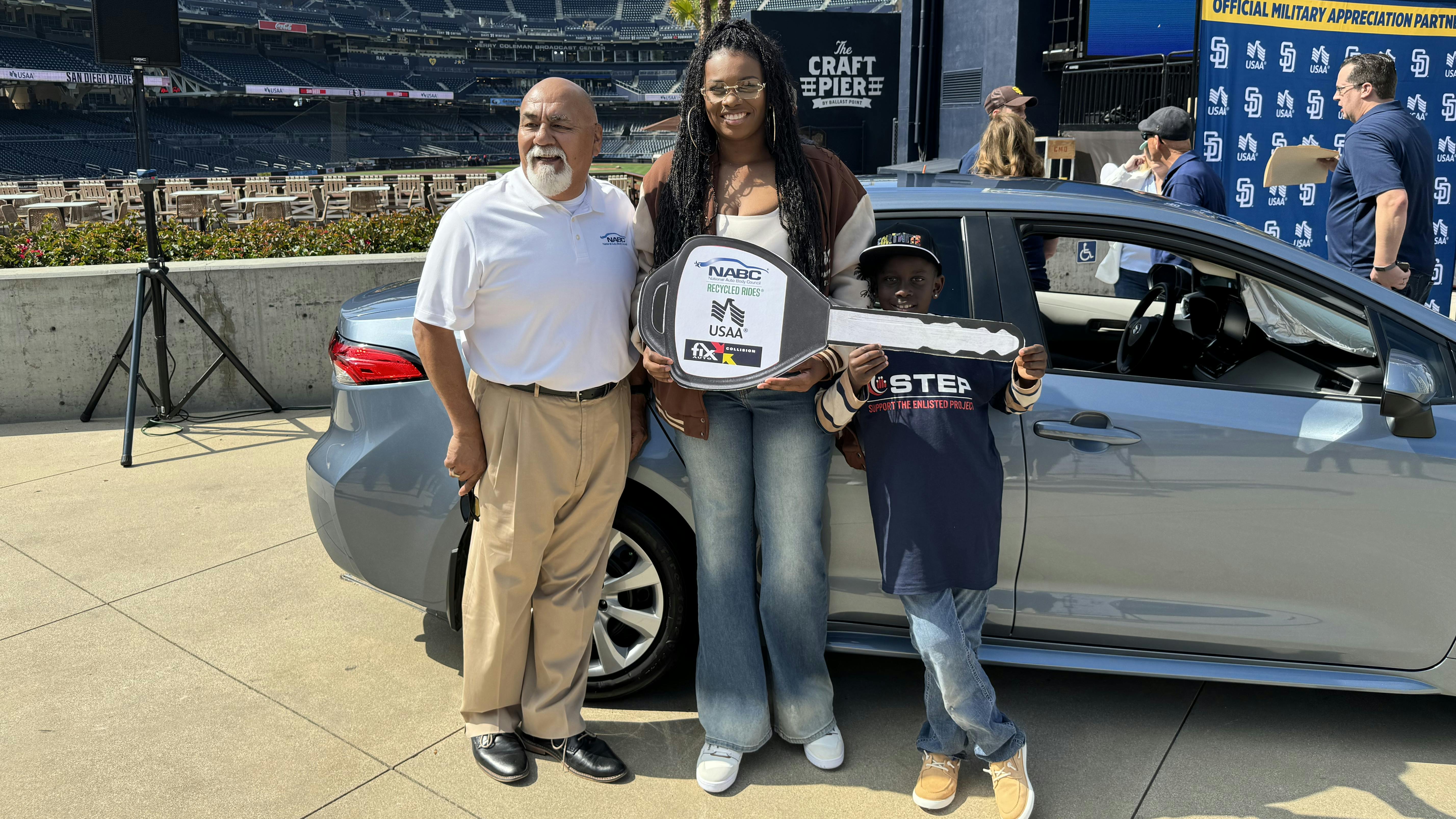 Olusola Smith receiving her refurbished 2022 Toyota Corolla .