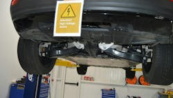 As this placard at I-CAR's Chicago Technical Center shows, it's critical to use a placard for EVs that have not had their battery disabled. A lift table is needed for this type of two-post lift to handle the battery. As this placard at I-CAR's Chicago Technical Center shows, it's critical to use a placard for EVs that have not had their battery disabled. A lift table is needed for this type of two-post lift to handle the battery.