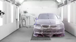 By placing the car to one side of the booth to allow access for only what is being painted, other parts can be loaded into the booth to be painted at the same time.
