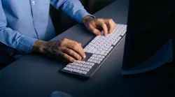 Man In Button Up Blue Shirt At Keyboard Dreamstime M 208165945 629fc4bb4d666