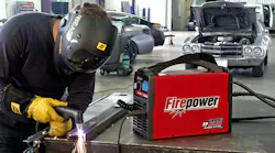 To create a smoother cut surface, the operator braces his left elbow on the table and uses his left hand to support the torch.