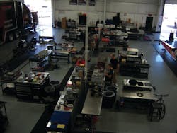 All techs have their own work areas in an open room. All techs have their own work areas in an open room.