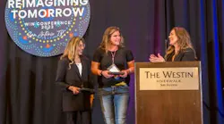From left, Jeanne Esquivel, business development manager, Enterprise Holdings; and Laura Kottschade, operations manager of Jerry's ABRA Auto Body & Glass – Mankato, Minnesota; were presented the WIN Cornerstone Award by WIN Chair Tanya Sweetland, General Manager, OEC.