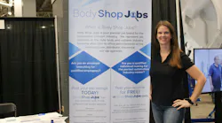 President Diane Benting poses for a photo at the BodyShopJobs.com booth at the Tasco Auto Color trade show.