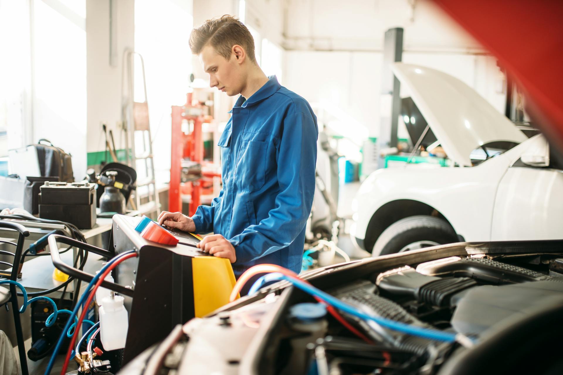 Technician monitoring A/C machine
