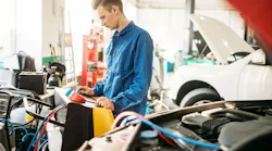 Technician monitoring A/C machine
