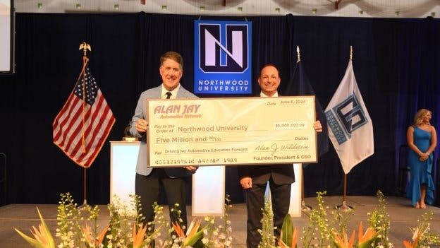 Pictured from left, Northwood University President Kent MacDonald and Dr. Alan Jay Wildstein, founder, president, and CEO of the Alan Jay Automotive Network.