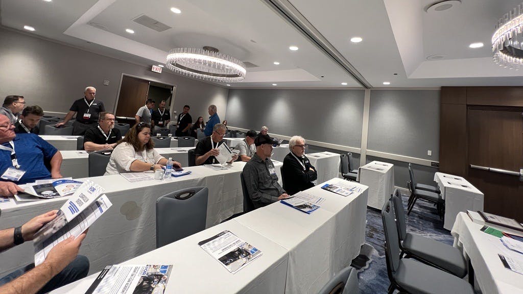 Instructors take their seats before the I-CAR Academy seminar during the ASE Instructor Training Conference in Minneapolis on Tuesday, July 16.