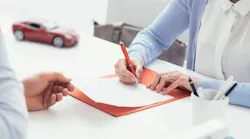 Car insurance paperwork signing