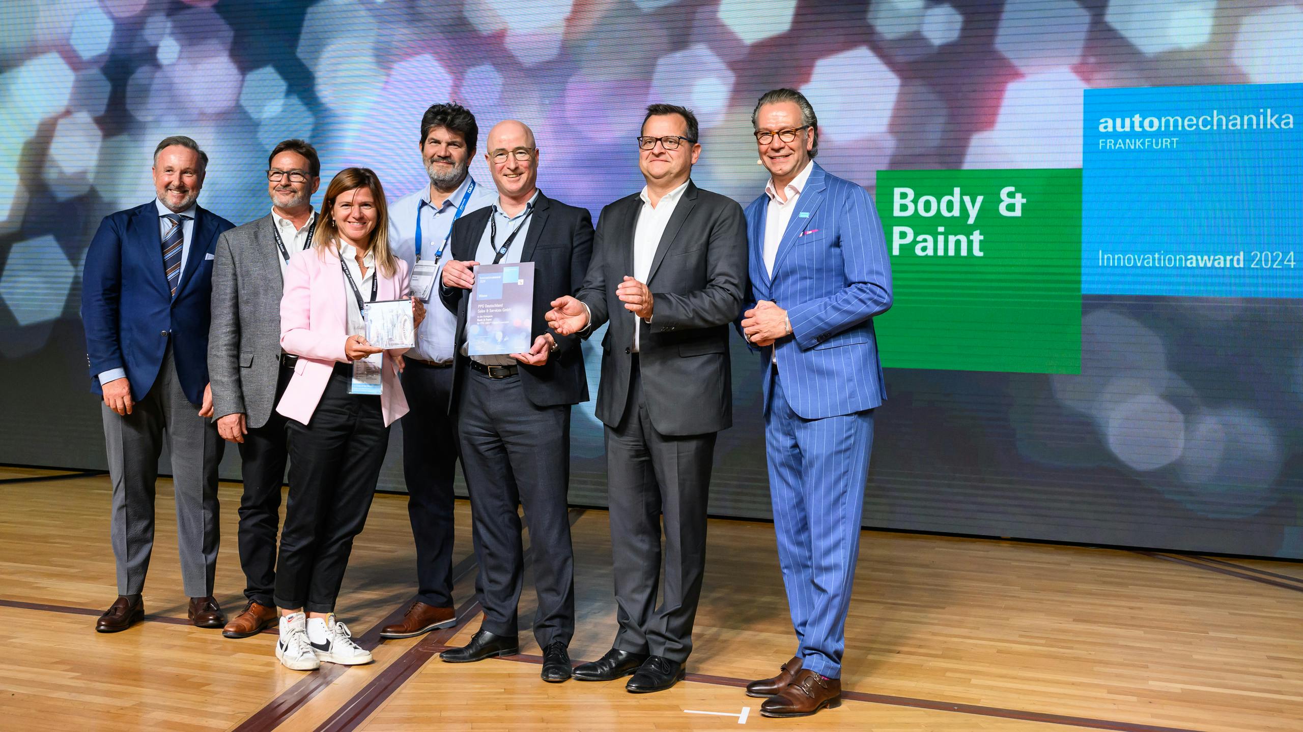 Pictured left to right: Jason Moseley, CEO IBIS worldwide; PPG Refinish team members Juan Navarro, marketing director EMEA; Sara Fanciano, business director EMEA South; Beppe Casalini, global digital business services sector; Jonathan Hatfield, business director EMEA North, Alban D&rsquo;Epenoux, global marketing director; and Michael Johannes, vice president Automechanika.