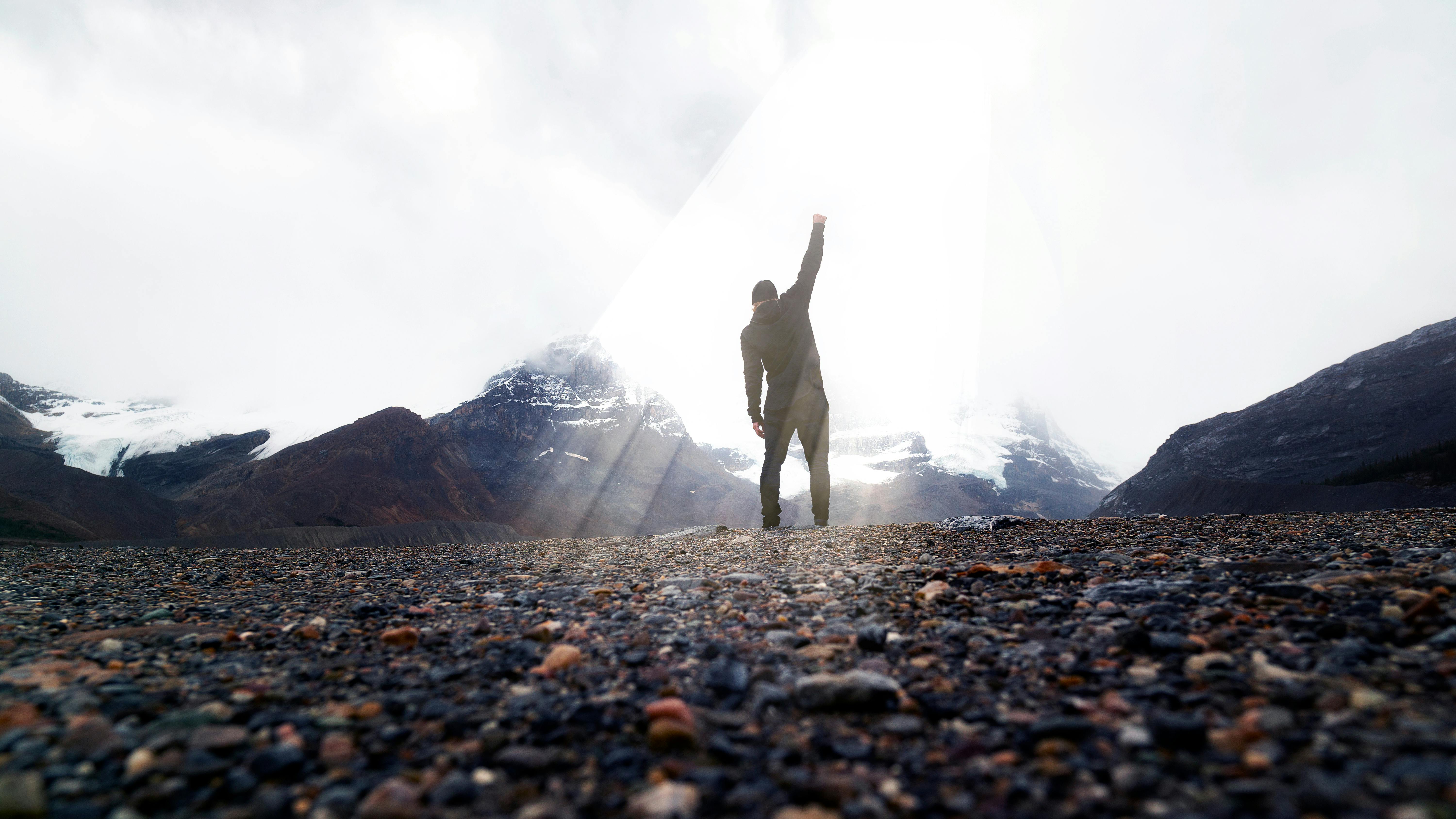 Dramatic Silhouette Victorious With Fist In Air On Summit