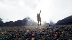 Dramatic Silhouette Victorious With Fist In Air On Summit
