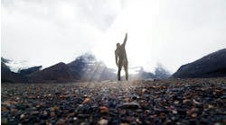 Dramatic Silhouette Victorious With Fist In Air On Summit Dramatic Silhouette Victorious With Fist In Air On Summit