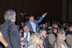 Attendees of the gala bid during the charity auction. Attendees of the gala bid during the charity auction.