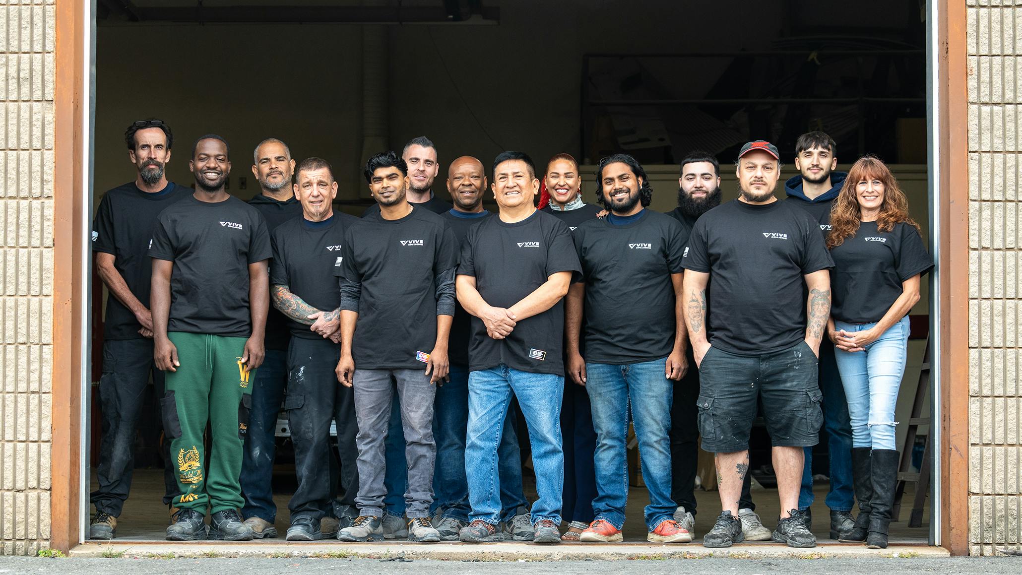 The staff of VIVE Collision's 50th location in Newington, Connecticut.