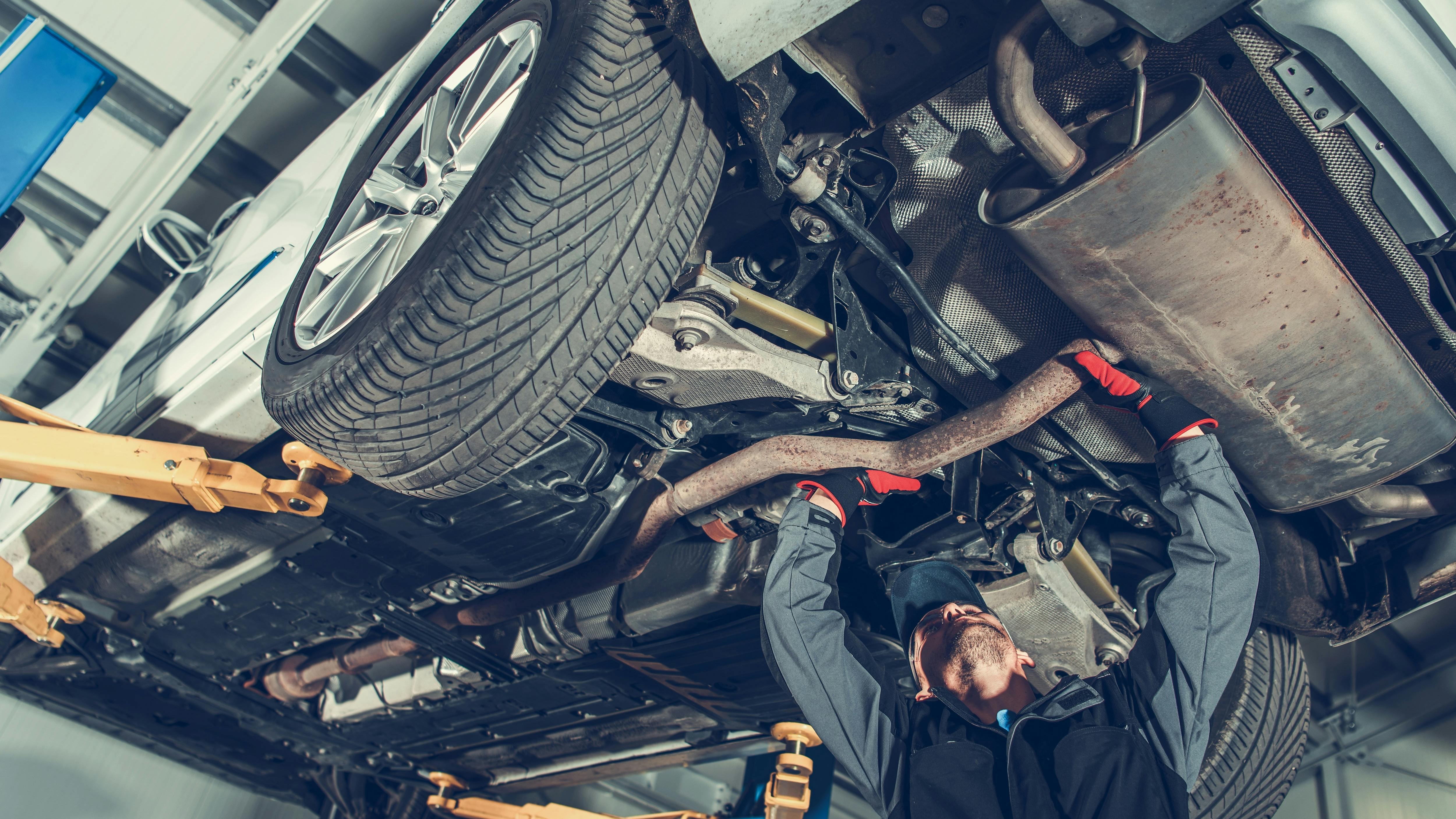6720f3f076983156803847df Technician Under Car Exhaust Adobestock 236597462