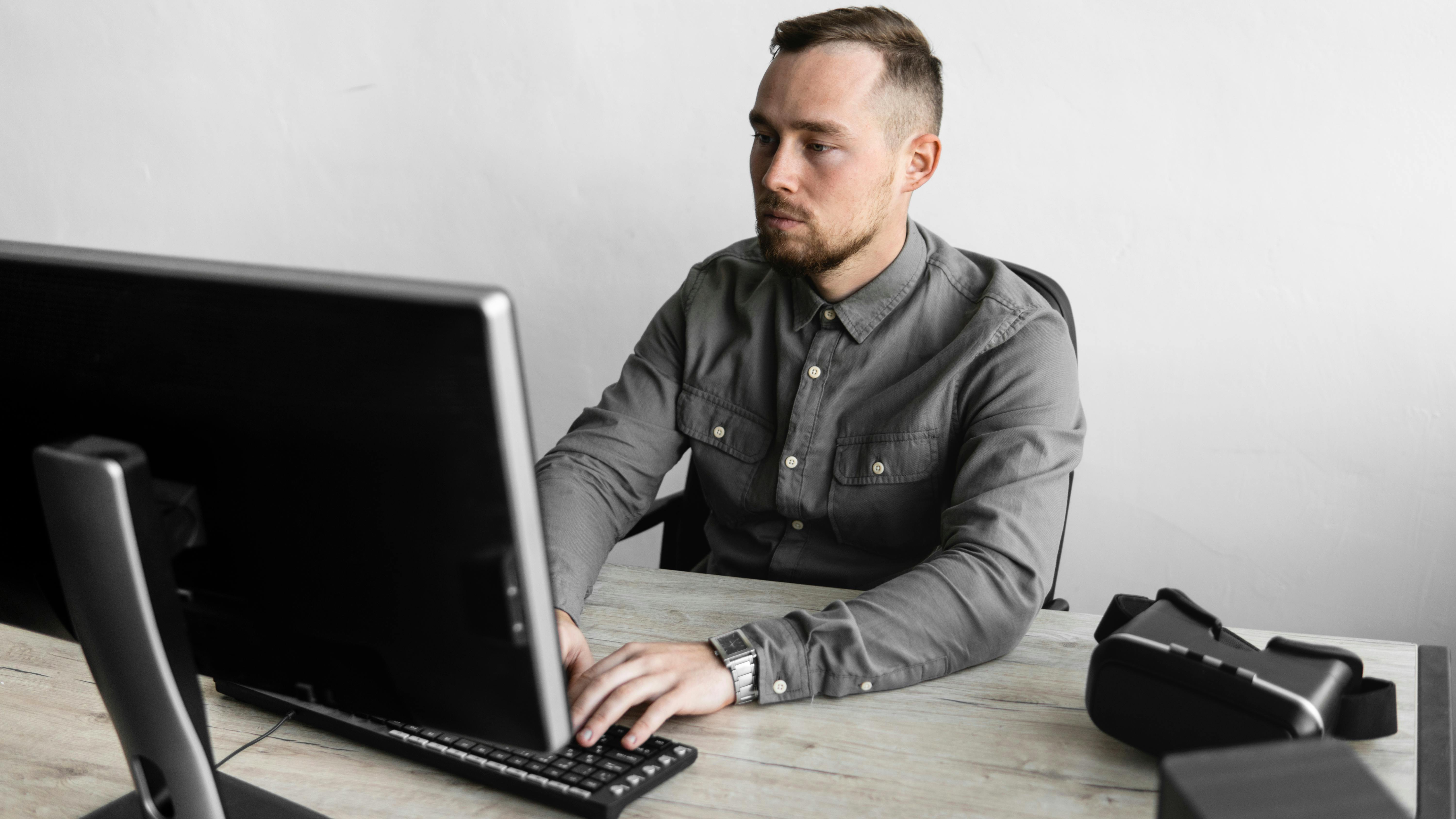 Man at desk on computer