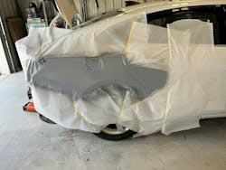 Primer surfacer applied over a larger area to cover multiple dents that were repaired. Primer surfacer applied over a larger area to cover multiple dents that were repaired.